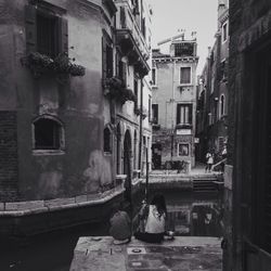 People sitting in front of old town