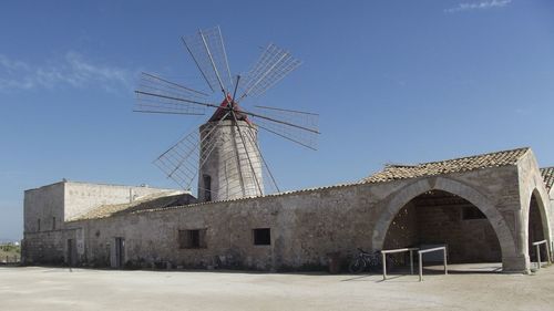 Traditional windmill against sky