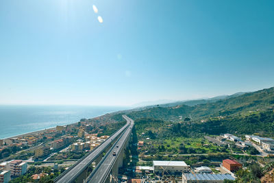View on the ionian coast with the typical coastal villages and the meandering highway.