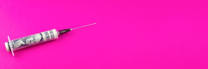 High angle view of pink colored pencils