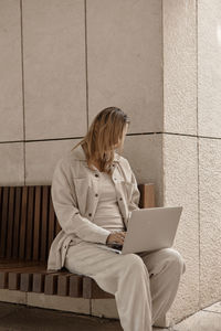 Young woman using laptop at home