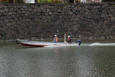 People on boat against sea