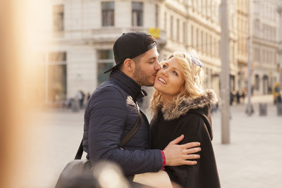 Young couple smiling in city
