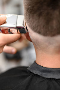 Close-up of man using mobile phone