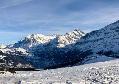 Scenic view of snowcapped mountains against sky