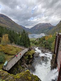 Bridge over mountains against sky