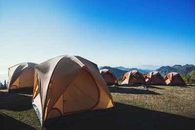 Tent on field against clear sky