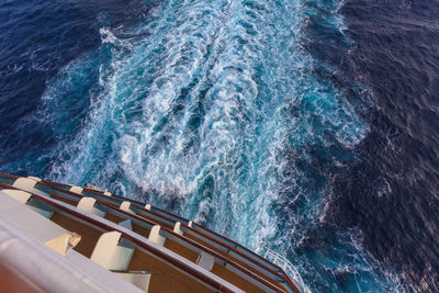 High angle view of ship sailing in sea with wake on the water