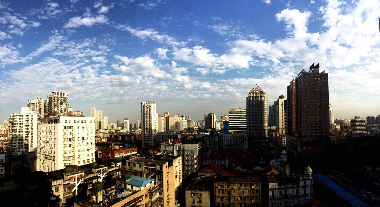 building exterior, city, architecture, built structure, cityscape, sky, skyscraper, cloud - sky, tall - high, modern, residential building, high angle view, office building, urban skyline, city life, residential district, tower, crowded, cloud, residential structure