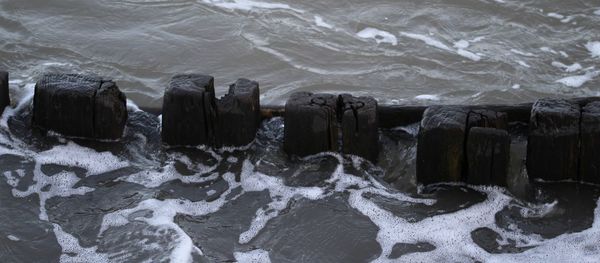 High angle view of rocks in sea