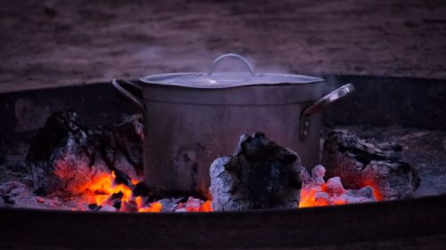 Close-up of container on fire pit