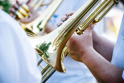 Midsection of person playing guitar