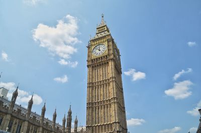 Low angle view of clock tower against sky