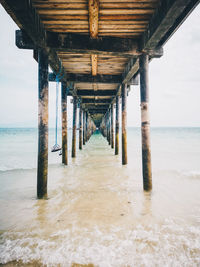 Weathered pier over sea