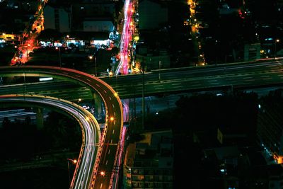 High angle view of light trails on road at night