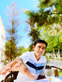 Young man sitting on table