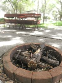 Close-up of old rusty wheel on field