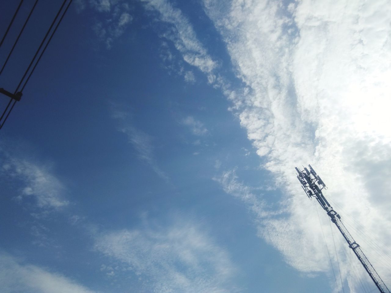 LOW ANGLE VIEW OF TELEPHONE AGAINST SKY