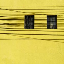 Electric cables shadow on wall