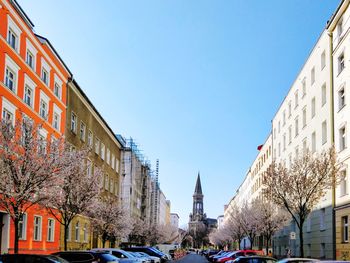 Panoramic view of buildings and city against clear sky