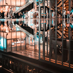 Symmetry view of people on glass floor