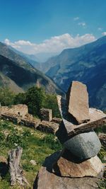 Scenic view of mountains and ruins against sky