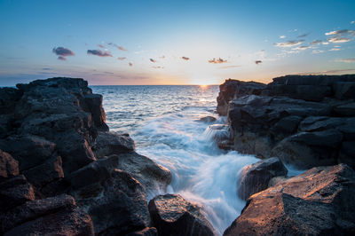 Scenic view of sea at sunset