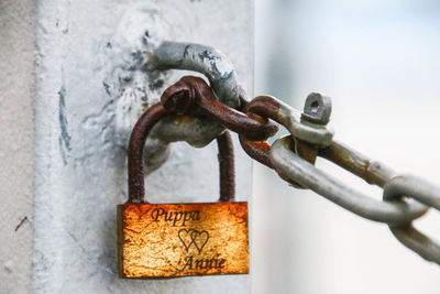 Close-up of padlocks on metal chain