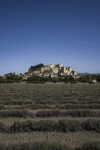 The famous typical grignan village in provence at sunrise from above - france