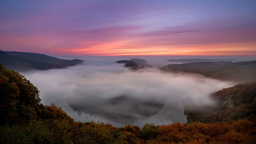 Scenic view of mountains against sky during sunset