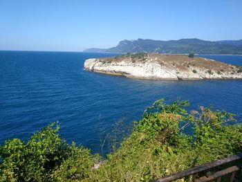 Scenic view of sea against clear blue sky