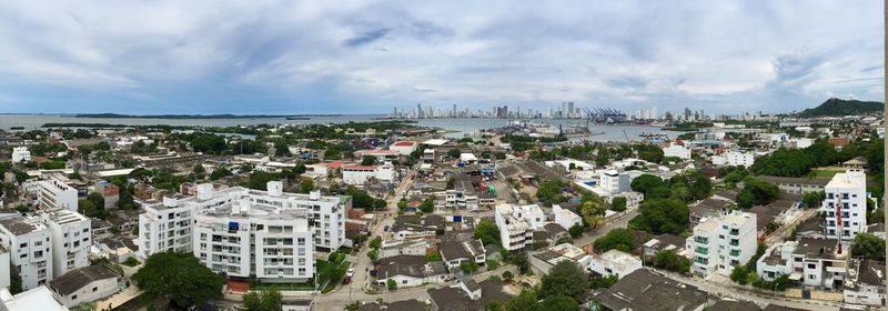 High angle view of city buildings against sky