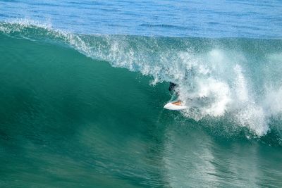 Person surfing in sea