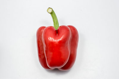 Close-up of red bell pepper against white background