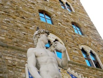 Low angle view of statue of historic building