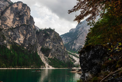 Scenic view of lake and mountains against sky