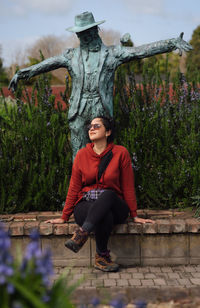 Portrait of young woman sitting outdoors