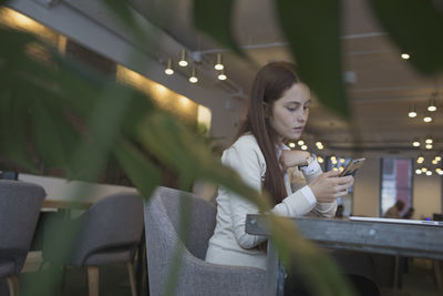 Young woman checking her smartphone.