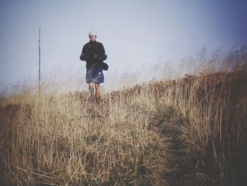 Woman standing on field