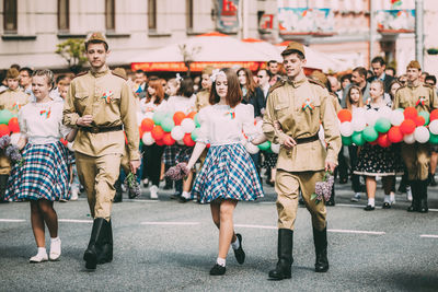 People walking on street in city