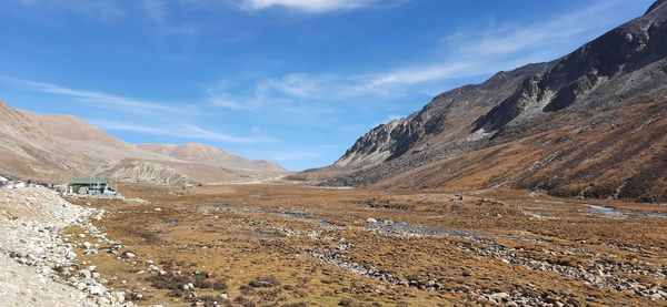 Scenic view of landscape and mountains against sky