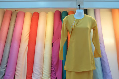 Close-up of clothes hanging in store