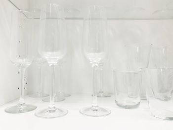 Close-up of wine glasses on table