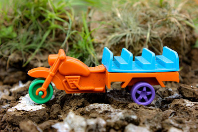 Close-up of toy car on sand