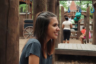 Side view of teenage girl at playground