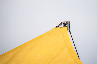 Yellow water-repellent awning in the park.