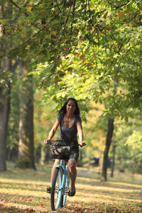 Woman riding bicycle at public park