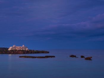 Scenic view of sea against sky at dusk