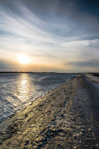 Scenic view of sea against sky at sunset