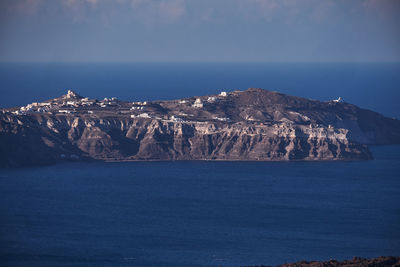 Panoramic aerial view of akrotiri village in santorini island, greece - traditional white houses